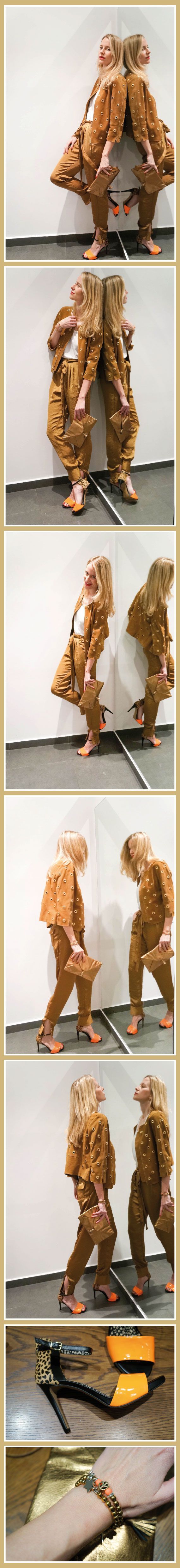 María León con cazadora de ante camel y pantalón de seda de HOSS INTROPIA, sandalia con print animal y naranja flúor de Jessica Simpson y pulseras en dorado con flúor de La Chsipa Adecuada.